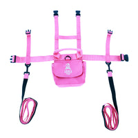 Pink ski training Harness laid flat with straps displayed on a white background